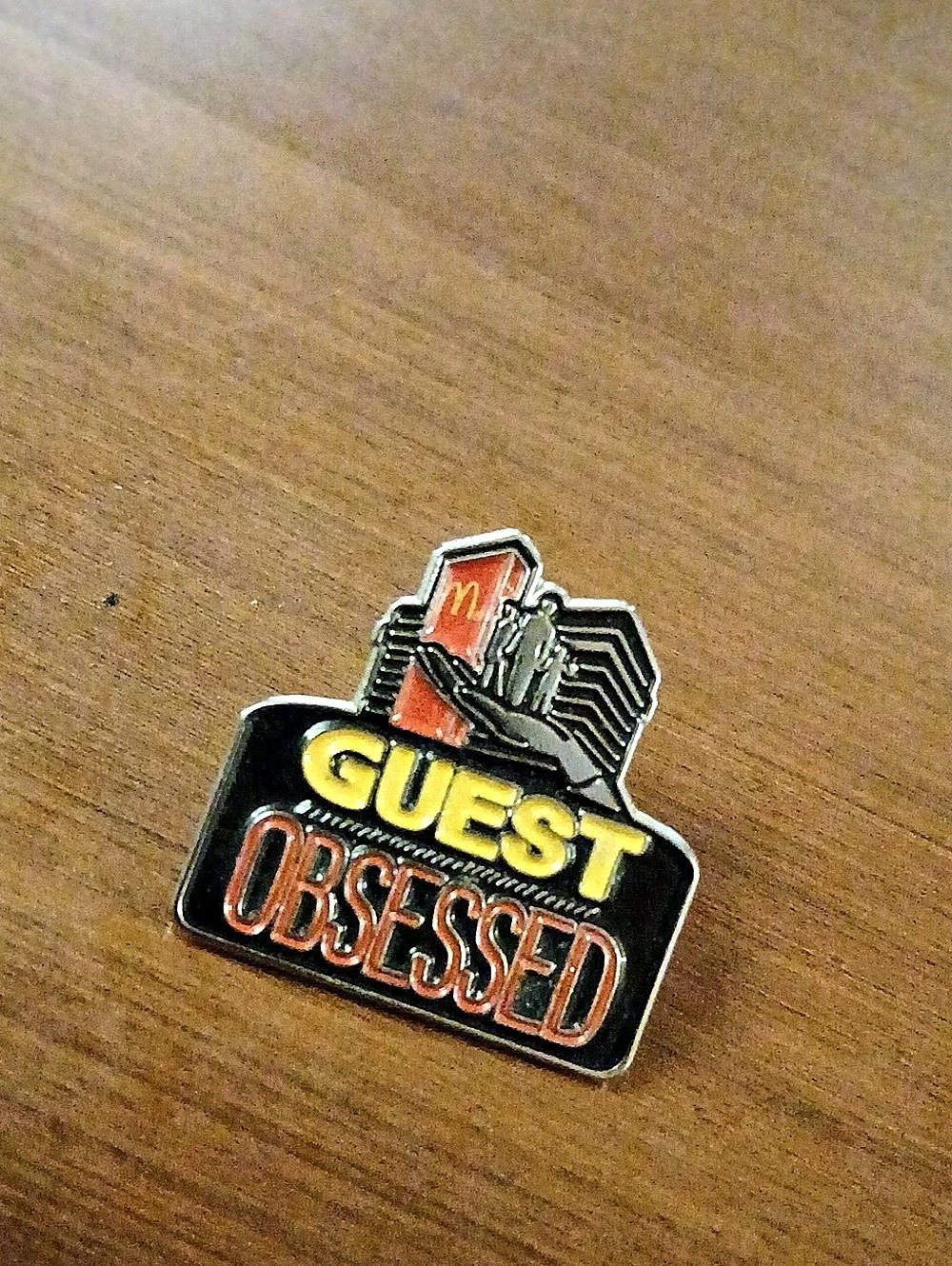 Vintage McDonald's Guest Obsessed Employee Lapel Pin Black & Red
